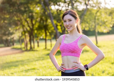 Sport Woman Exercise To Keep Good Shape And Standing In The Park