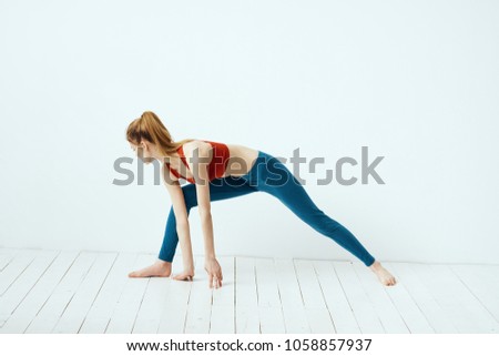 Similar – Image, Stock Photo Young woman stretching legs by sea pier