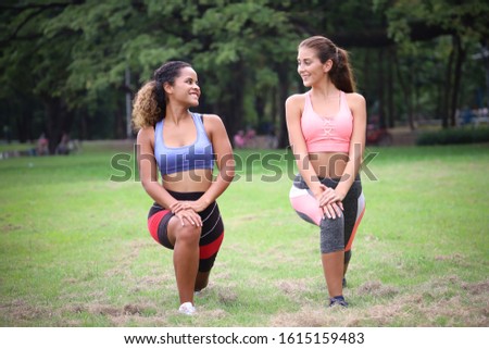 Sport woman play yoga in a green park, healthy or exercise or relaxing activity with stretch arms and legs