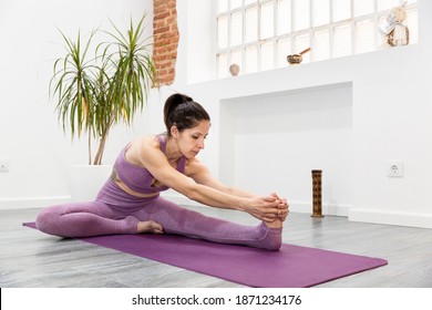 Sport Woman Streching At Home. Fitness And Yoga Concept. Space For Text.