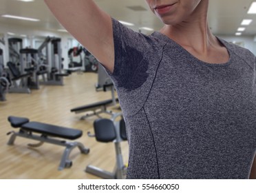 Sport Women Armpit Sweating In Gym. Transpiration Stain. Hyperthyroidism Concept