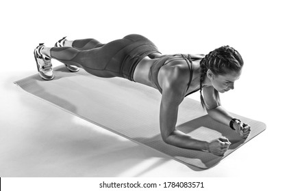 Sport. Young Athletic Woman Doing Plank. Muscular And Strong Girl Exercising. Fitness Exercising.