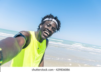 Sportive Black Man Taking Selfie At The Beach