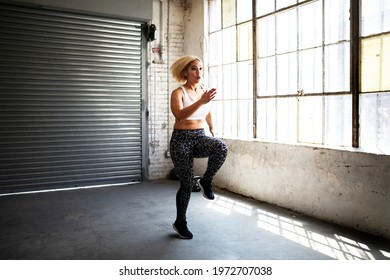 Sportive Blond Woman Doing High Knees