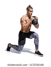 Sportive man workout with kettlebell doing lunges. Photo of young man with good physique isolated on white background. Strength and motivation.