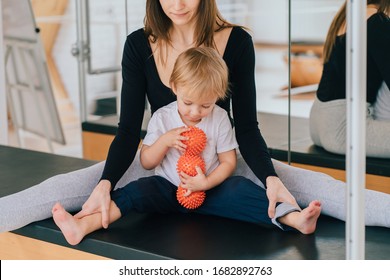 Sportive Mother Sitting On Pilates Reformer Stock Photo 1682892763 ...