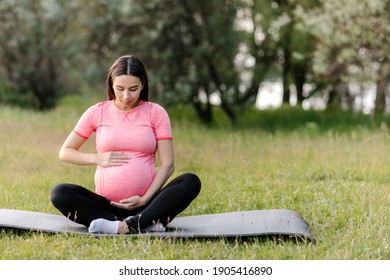 Sportive Pregnant Woman Outdoors. Sport During Pregnancy. Health And Beauty Of Pregnant Woman. Fitness During Pregnancy. Healthy Pregnancy