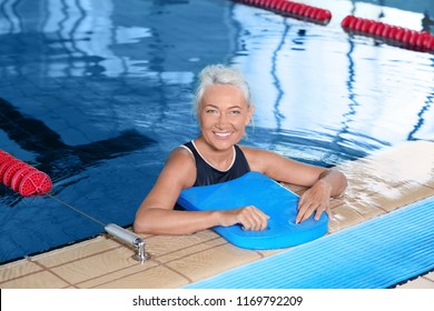 Sportive Senior Woman In Indoor Swimming Pool