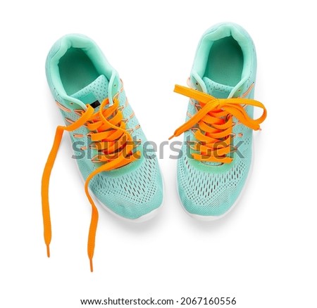 Sportive shoes with orange laces on white background 商業照片 © 