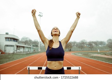 Sportive Woman Celebrating After Winning A Runner Competition