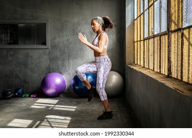 Sportive woman doing a high knees