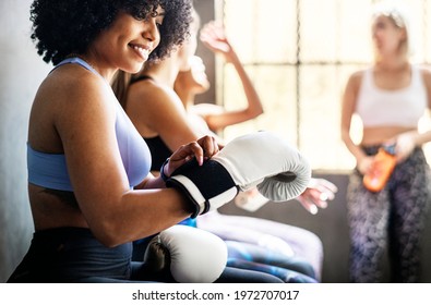 Sportive women talking in a gym - Powered by Shutterstock