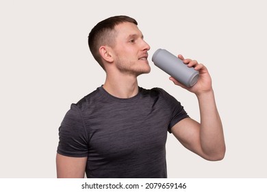 Sportman Drinking From Tin Can Drink. Energy Drink For Sport. Man With Can In Hands.