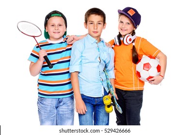 Sports and activities for children. Group of happy boys and a girl posing at studio. Education. Isolated over white background.
