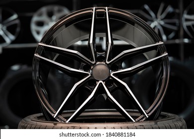 Sports Alloy Wheel Rim With Carbon Cover, In The Hall Of The Car Shop On The Background Of Wheels. Front View.