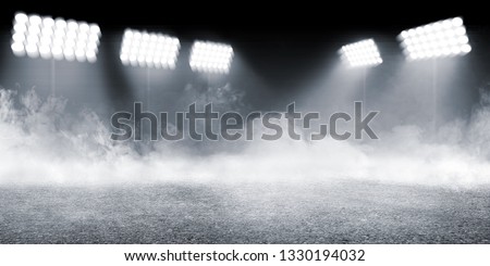 Sports arena with concrete floor with smokes and spotlights against dark background