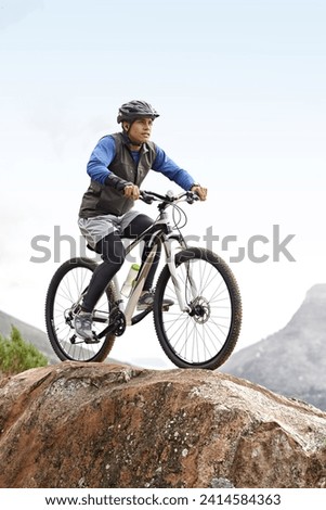 Sports, athlete and a man on a bike on the mountain for cycling, training and travel in nature. Idea, health and a male cyclist on a hill with a bicycle for riding, exercise and an outdoor workout