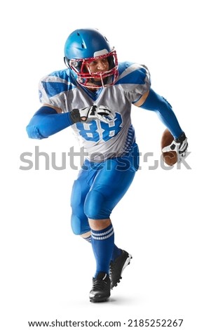 Sports attack. Sportsman in action. American football. A young agile American football player runs fast