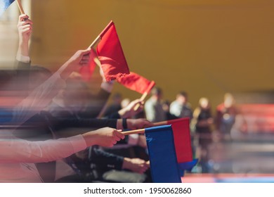 Sports background. Judges with red and white flags in contact martial arts competitions. Sports lifestyle. Added motion blur to enhance the presence effect. 