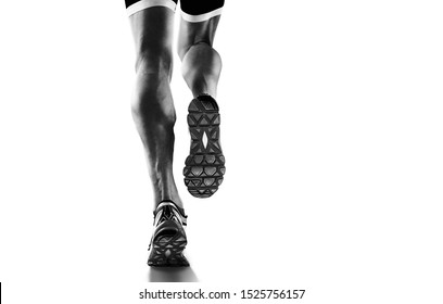 Sports background. Runner feet running closeup on shoe. Isolated on white.