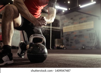 Sports background. Young athlete getting ready for crossfit training. Powerlifter hand in talc preparing to bench press. - Powered by Shutterstock