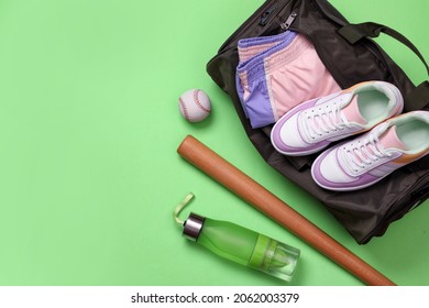 Sports Bag And Baseball Equipment On Light Green Background, Flat Lay. Space For Text