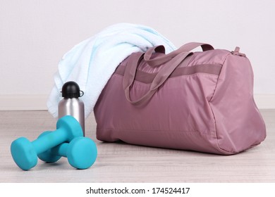 Sports Bag With Sports Equipment In Gymnasium