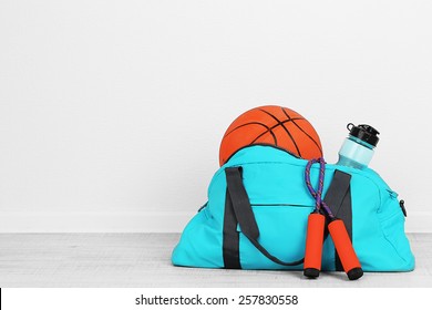 Sports Bag With Sports Equipment In Room