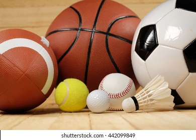 sports balls on wooden background