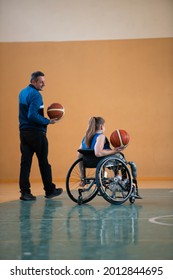 A Sports Basketball Coach Explains To A Disabled Woman In A Wheelchair Which Position To Play During A Game