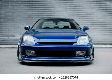 Sports car front view. Image of a blue sports car on the wall