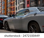 a sports car on the background of a house