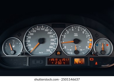 Sports car tachometer and dashboard with backlight. Close-up view of the modern car dashboard. Arrow of speedometer of supercar  - Powered by Shutterstock