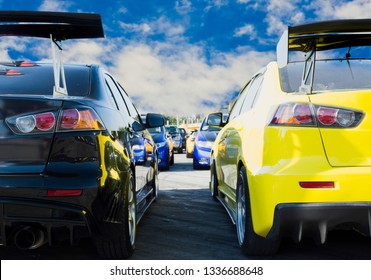 Sports Car And Used Cars, Parked In The Parking Lot Of Dealership Waiting To Be Sold And Delivered To Customers And Waiting For The Auction With The Trading Concept And Auction In Automotive Industry