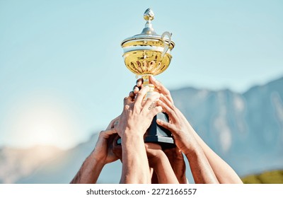 Sports, champion and hands of team with trophy for achievement, goal and success together. Celebration, winner and people holding an awards cup after winning a sport competition or rugby tournament - Shutterstock ID 2272166557