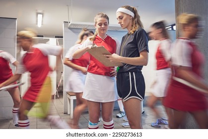 Sports, coaching and hockey with women in locker room for teamwork, fitness and planning. Checklist, health and motion with hockey player and mentor ready for games, wellness and exercise training - Powered by Shutterstock