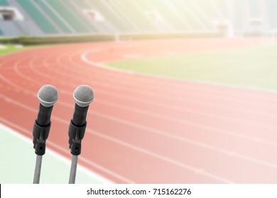 Sports Commentator With Running Field Stadium Background With Space For Text