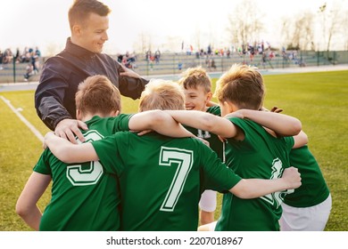 Sports Competition for Children. Boys Sport Team Huddle. Coach and Young Football Players Huddling. Kids of Soccer Team Gathered Before the Tournament Final Match - Powered by Shutterstock