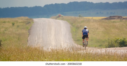 A Sports Cyclist On A Stone Track Crossing Salisbury Plain, Wiltshire UK