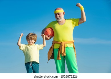 Sports Education. Senior Man And Child In Family Health Club. Grandfather And Son Doing Exercises. Doing Sports Is Free. Healthy Life And Sport Concept