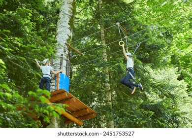 Sports entertainment and activity in the form of passing the route of the rope park. - Powered by Shutterstock