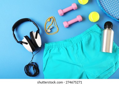 Sports Equipment And Shorts On Color Table, Top View