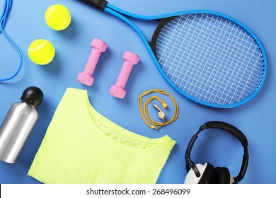 Sports Equipment And T-shirt On Color Table, Top View