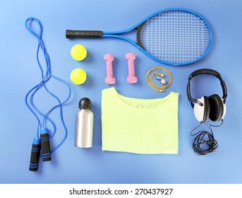 Sports Equipment And T-shirt On Color Table, Top View