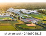 Sports facilities at public school in North Port, Florida. American football stadium, tennis court and baseball diamond sport infrastructure