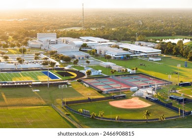 Sports facilities at public school in North Port, Florida. American football stadium, tennis court and baseball diamond sport infrastructure - Powered by Shutterstock