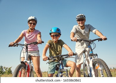 Sports family riding bicycles. Father, mother and son with bikes - Shutterstock ID 1655863861