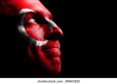 Sports Fan - A Patriot. On The Painted Colors Of The Flag Of His Country On His Face.