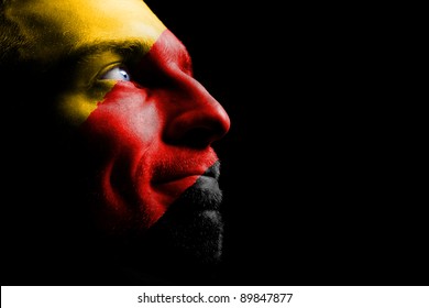 Sports fan - a patriot. On the painted colors of the flag of his country on his face. - Powered by Shutterstock