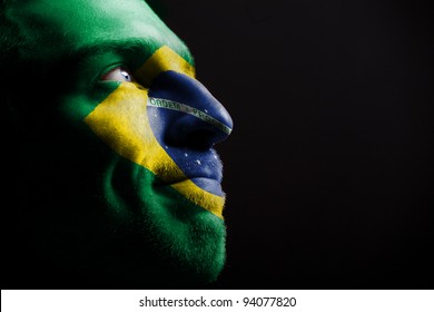 Sports Fan - A Patriot. On The Painted Colors Of The Flag Of His Country On His Face.